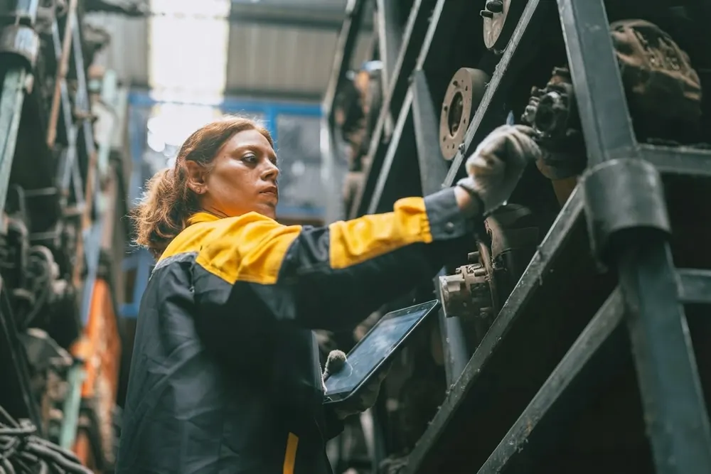 Manufacturing operator working with production equipment