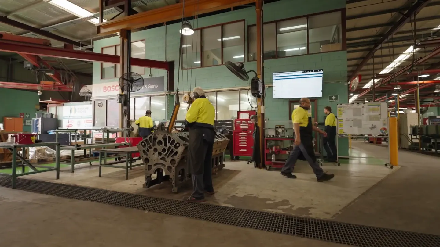 Operators on the shop floor with digital production board