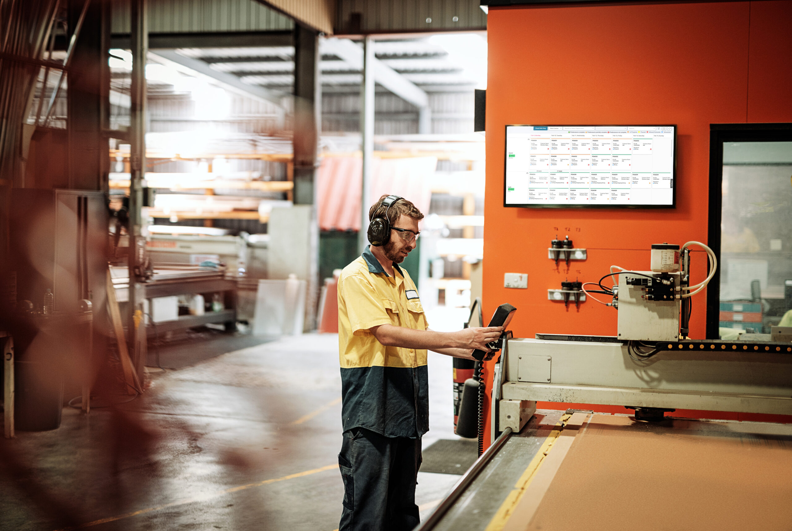 Man working at machine on shop floor